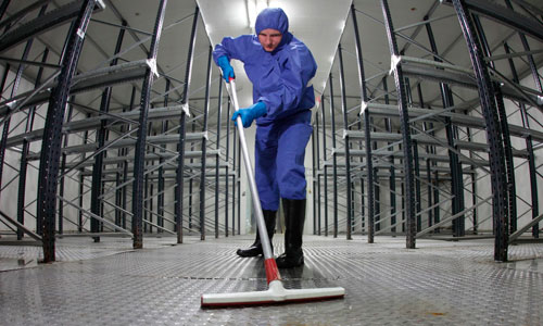 Specialist cleaning the floor